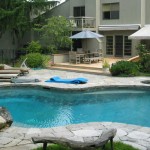 A gorgeous pool with with stone decking we installed in Westchester, NY
